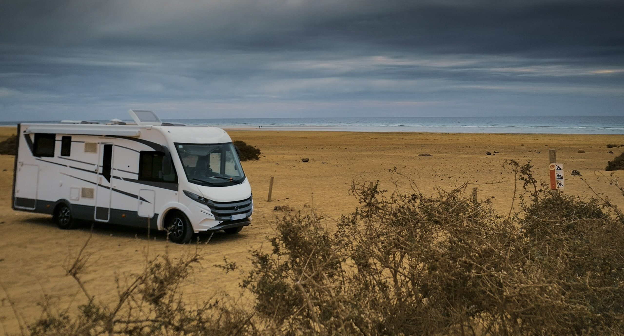 A Guide to the Ownership Costs of a Campervan Across the UK - Campervan on the beach